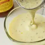 New Orleans soaked salad dressing recipe in a bowl with fresh ingredients