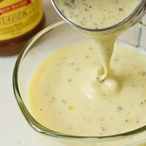 Authentic New Orleans Soaked Salad Dressing Recipe | Easy & Delicious New Orleans soaked salad dressing recipe in a bowl with fresh ingredients