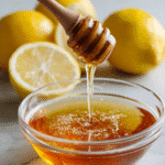 Canaan honey trick mixing spoon with honey and lemon in glass bowl