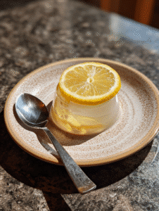 finished bariatric gelatin recipe with lemon slice garnish and spoon